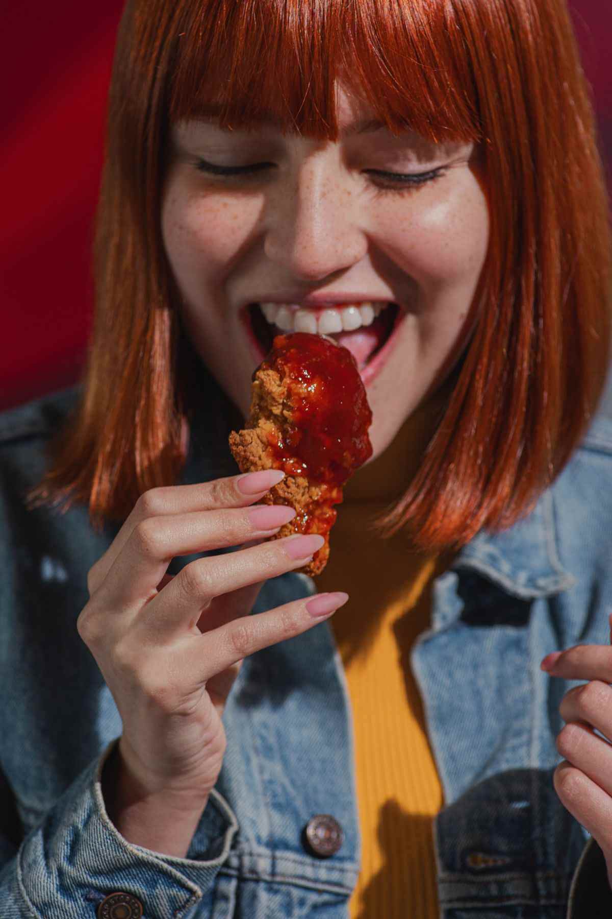 Close-up of loaded fries with chicken and cheddar